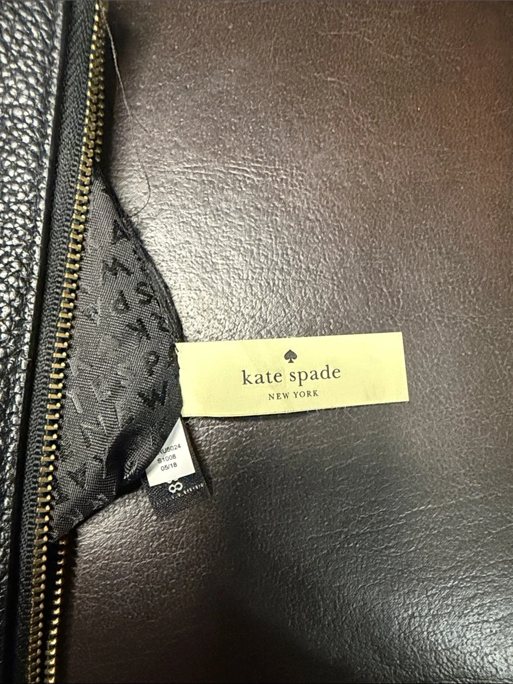 kate spade black pebbled leather toiletry pouch with embossed logo